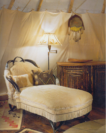 Many of the furnishings were made by Native American artisans, Lohr notes. A Wyoming furniture maker walked the forests and riverbeds to find burl fir for the bed frame. The Beacon style fabric on the bedcovering is from Ralph Lauren.